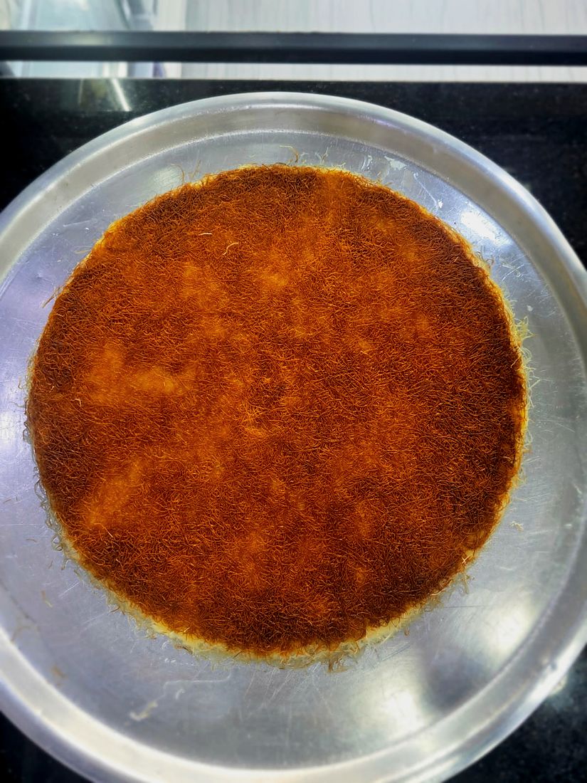 A real golden khishneh tray just after the flip