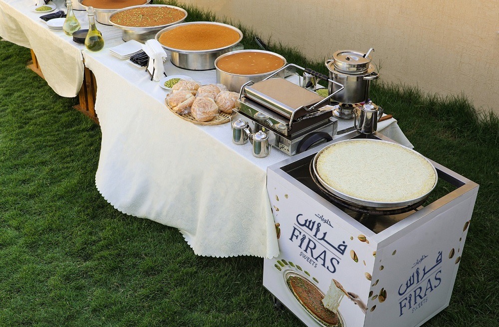 Firas Sweets kunafa live station cart at an outdoor event